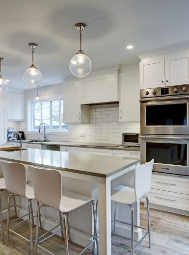 contemporary kitchen, quartz counters, island stools, wood tiles